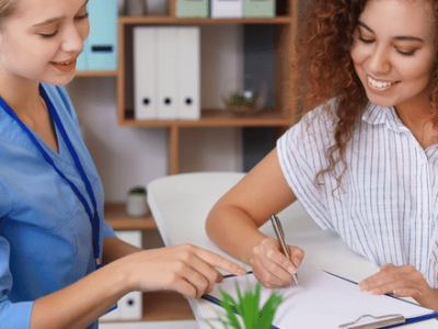 Public Health Practice Teammate and SPH Student conducting a patient intake