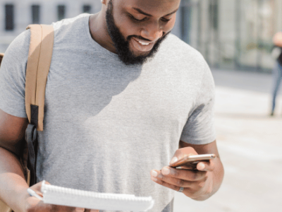SPH Student reading their text alert from the OHSU-PSU SPH Texting Service