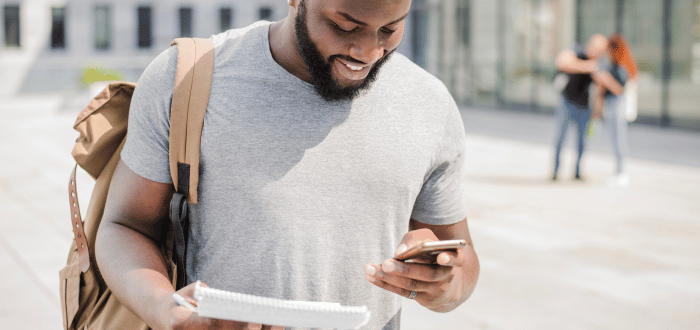 SPH Student reading their text alert from the OHSU-PSU SPH Texting Service