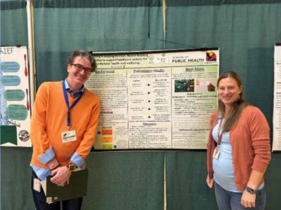 Assistant Professor Kathleen Conte and MPH Student Levi Mattoon presenting their research