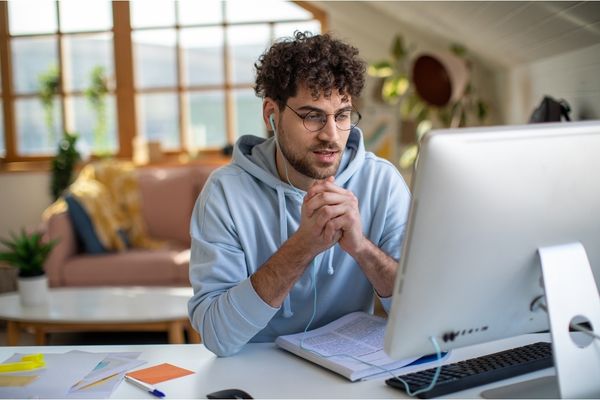 Master of Public Health Student registering for Fall Courses on his home desktop computer