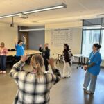Rural Public Health Initiative Summer Camp Counselors and OHSU-PSU School of Public Health Faculty and Student interacting in educational activity.